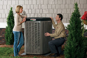 HVAC Equipment: Customer & technician next to an outdoor Lennox AC unit